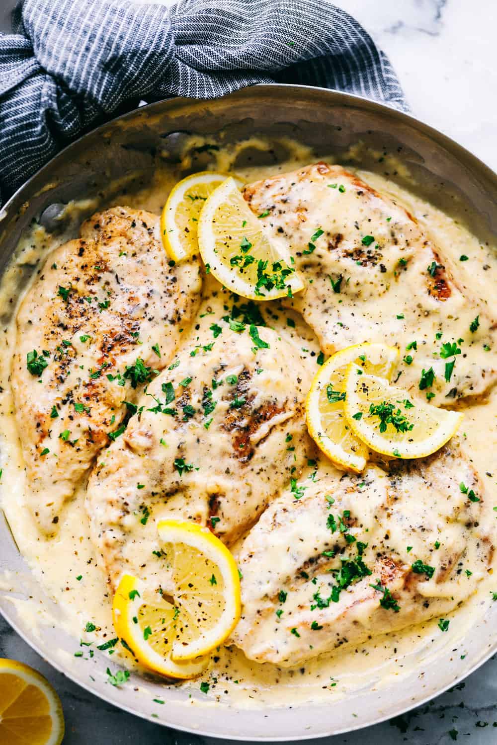 Creamy Lemon Parmesan Chicken in a pan.