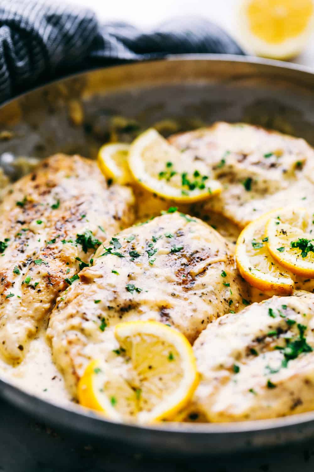 Creamy parmesan chicken in a pan.