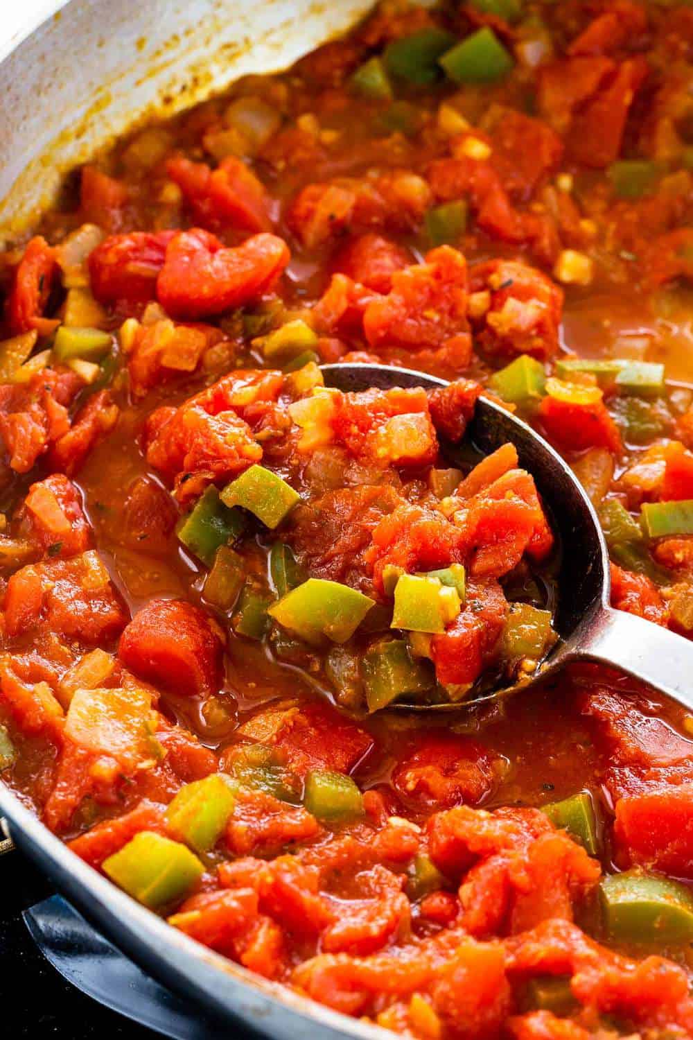 tomato sauce cooking in a skillet