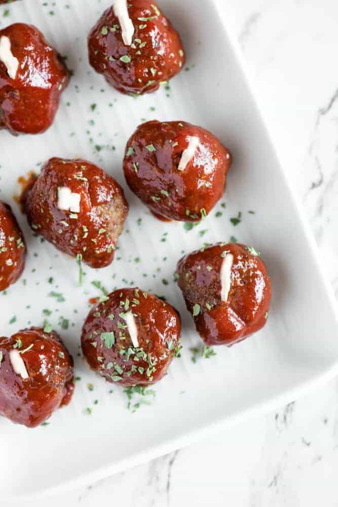 Meatloaf meatballs in rows in a baking pan.