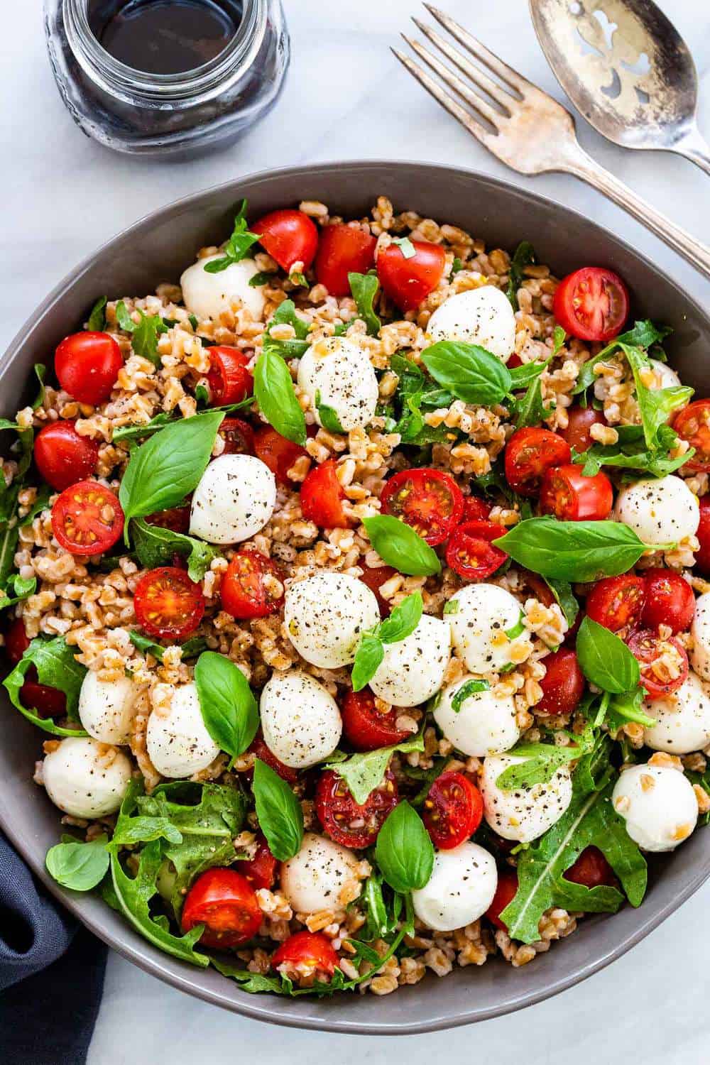 Farro Caprese Salad mixed together in a bowl