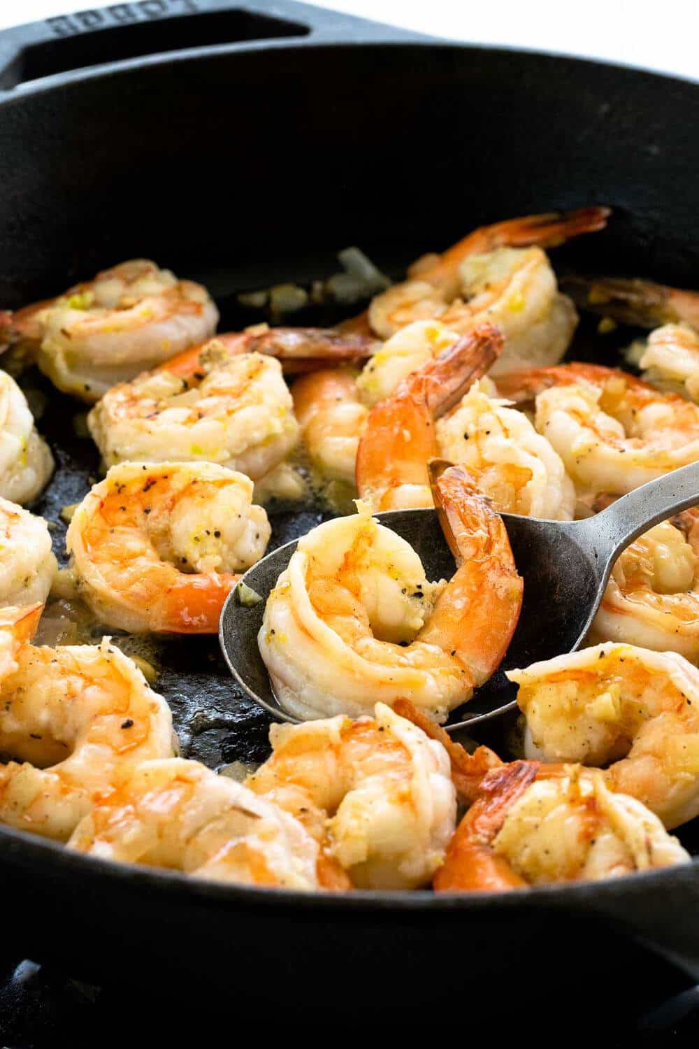 shrimp cooking in a cast iron skillet