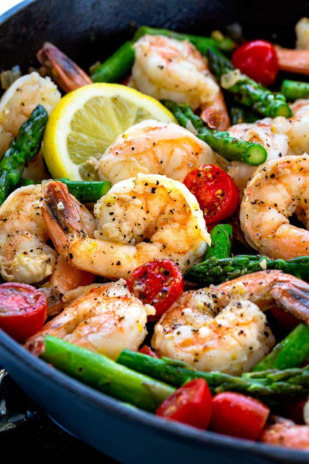 shrimp and vegetables in a cast iron skillet