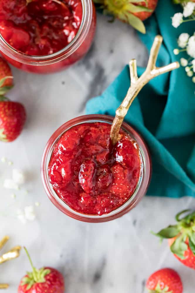 Strawberry sauce in glass jar -- overhead view