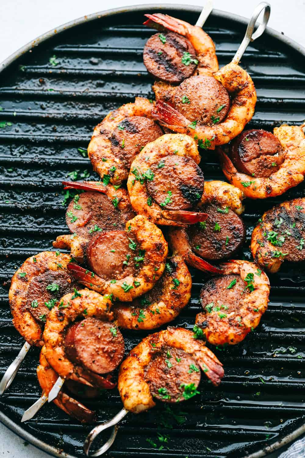 Easy and Amazing Cajun Shrimp and Sausage Skewers on a grill pan.