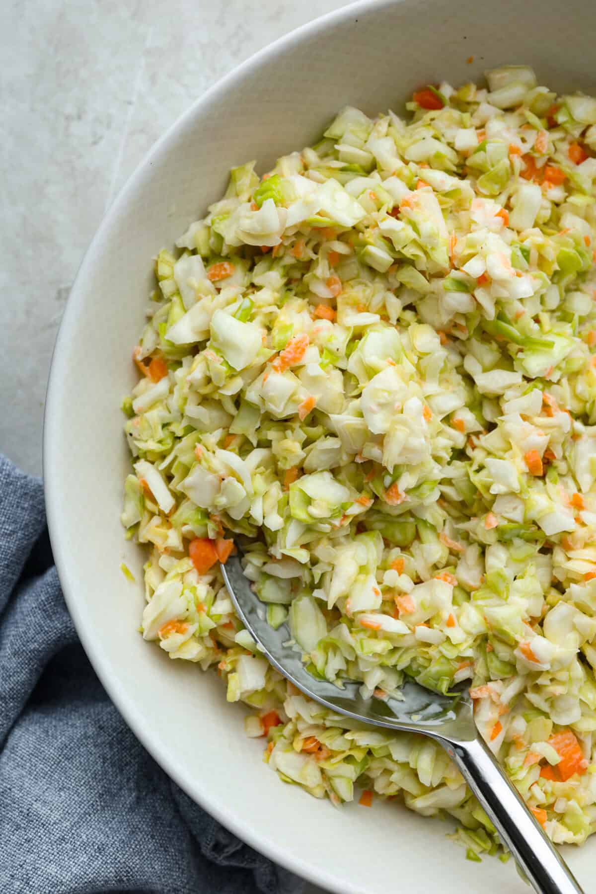 Close up shot of copycat KFC coleslaw in a serving bowl. 