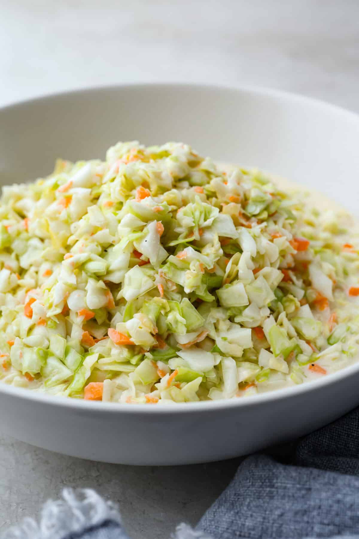 Angle shot of copycat KFC coleslaw in a serving dish. 