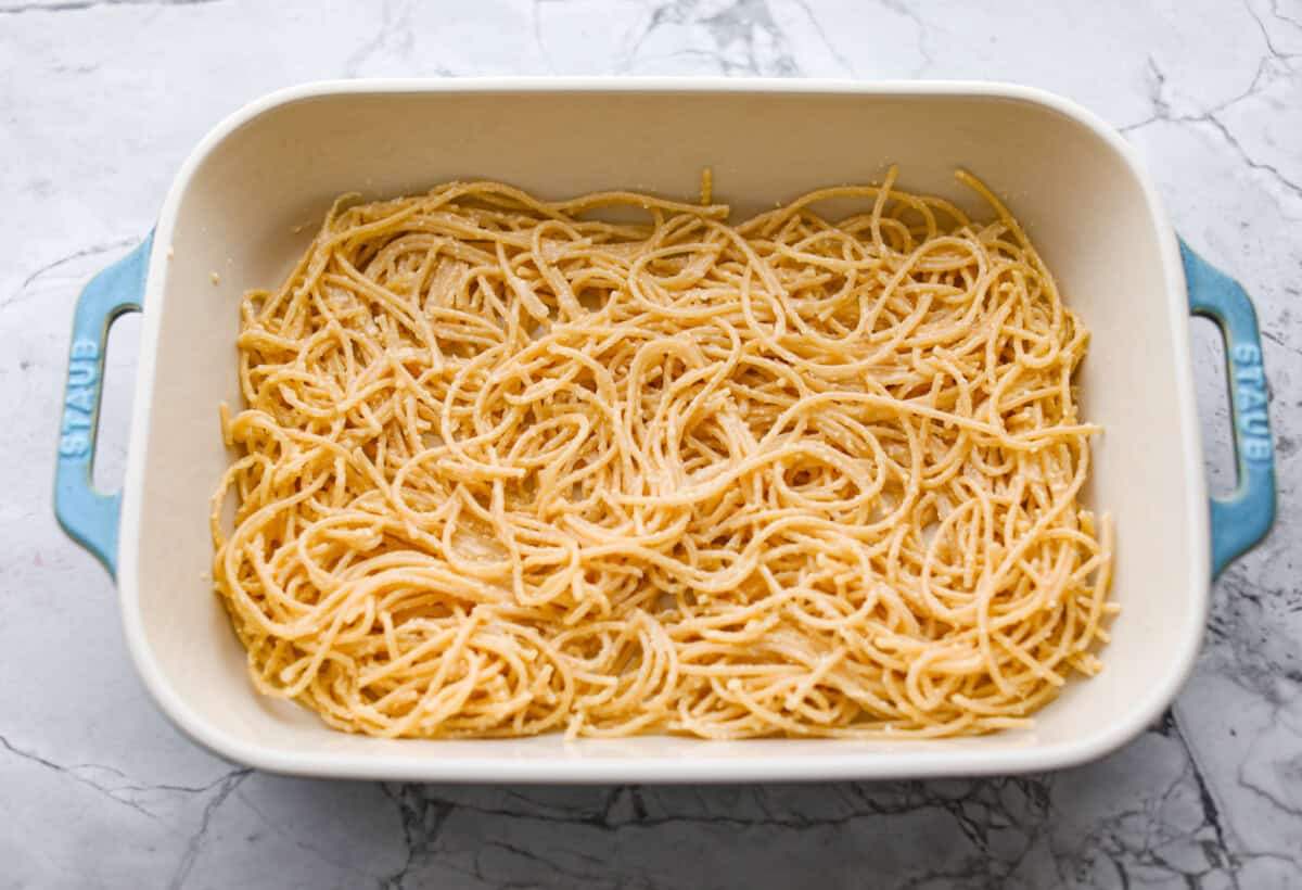 Layer of noodles in the bottom of a baking dish. 