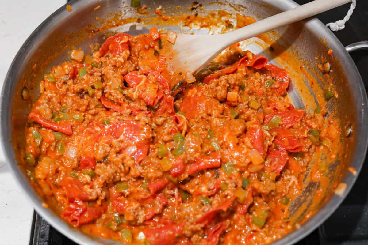 Overhead shot of meat and veggie mixture mixed in with cheeses and sauce. 