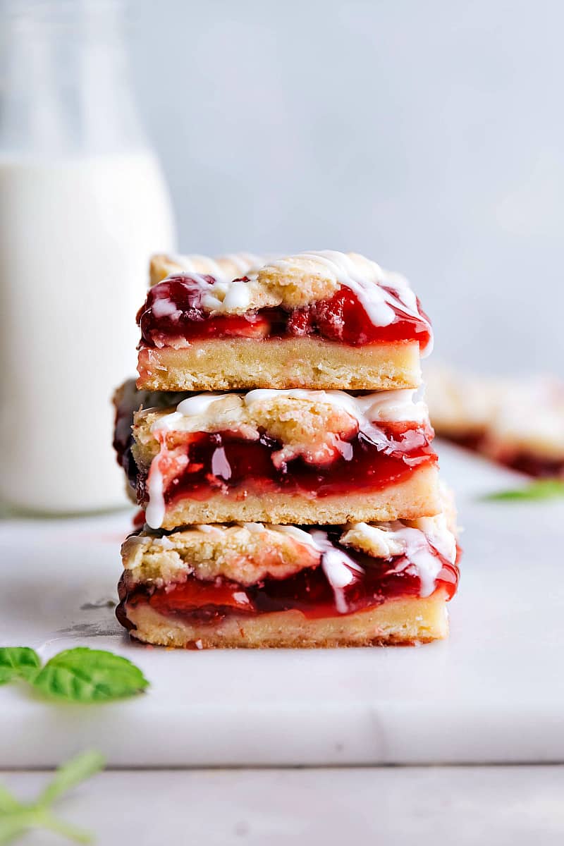 Up close shot of cherry pie bars stacked on top of each other