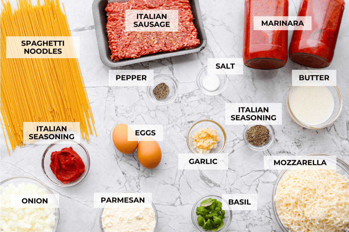 Overhead shot of labeled baked spaghetti ingredients. 