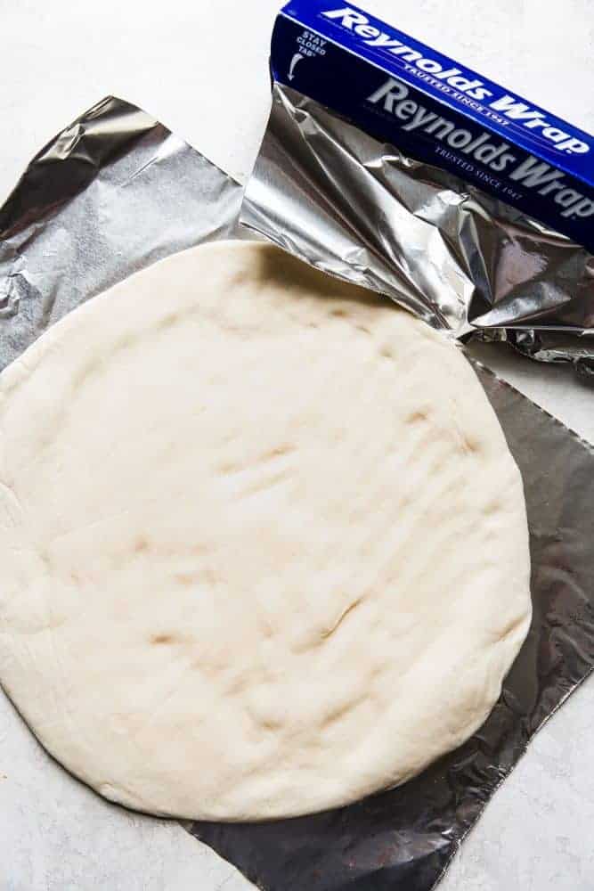 pizza dough on aluminum foil
