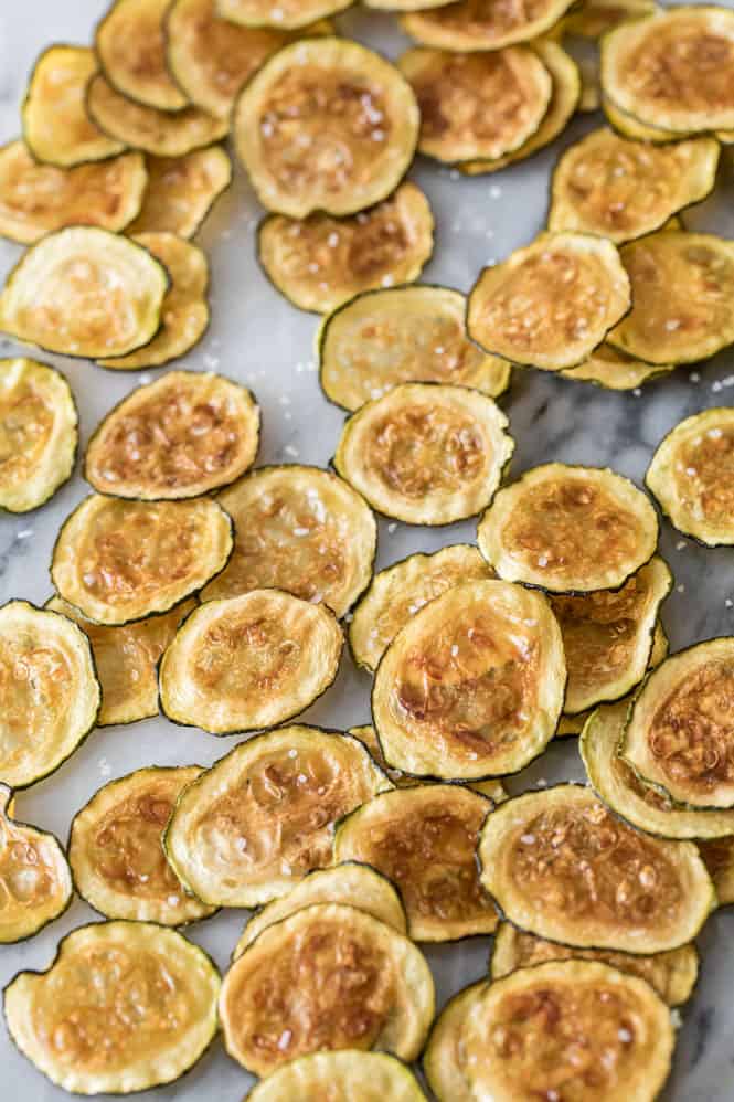 Zucchini chips that are baked, seasoned and ready to eat. 