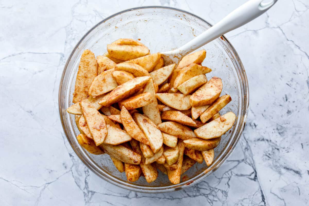 Overhead shot of apples coated in the and cinnamon and brown sugar mixture 