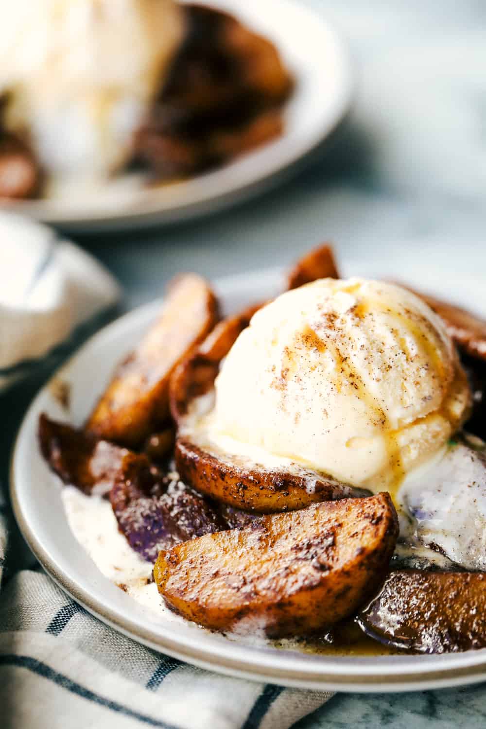 brown sugar cinnamon baked apples with ice cream on top.