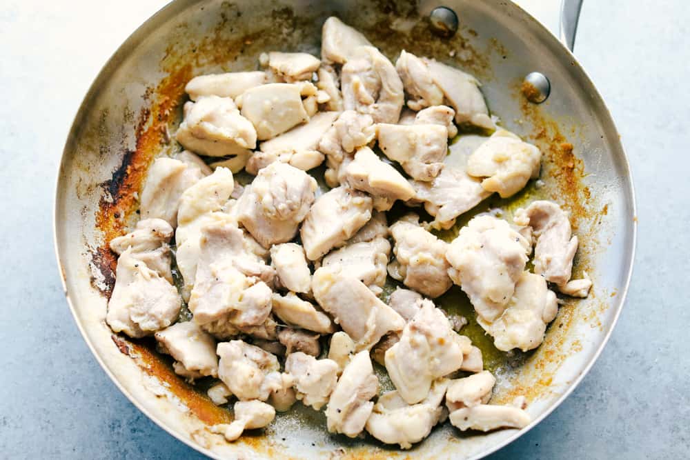 chicken cooking in a skillet