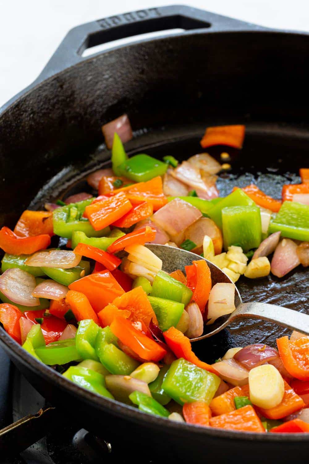 sauteing vegetables in a skillet