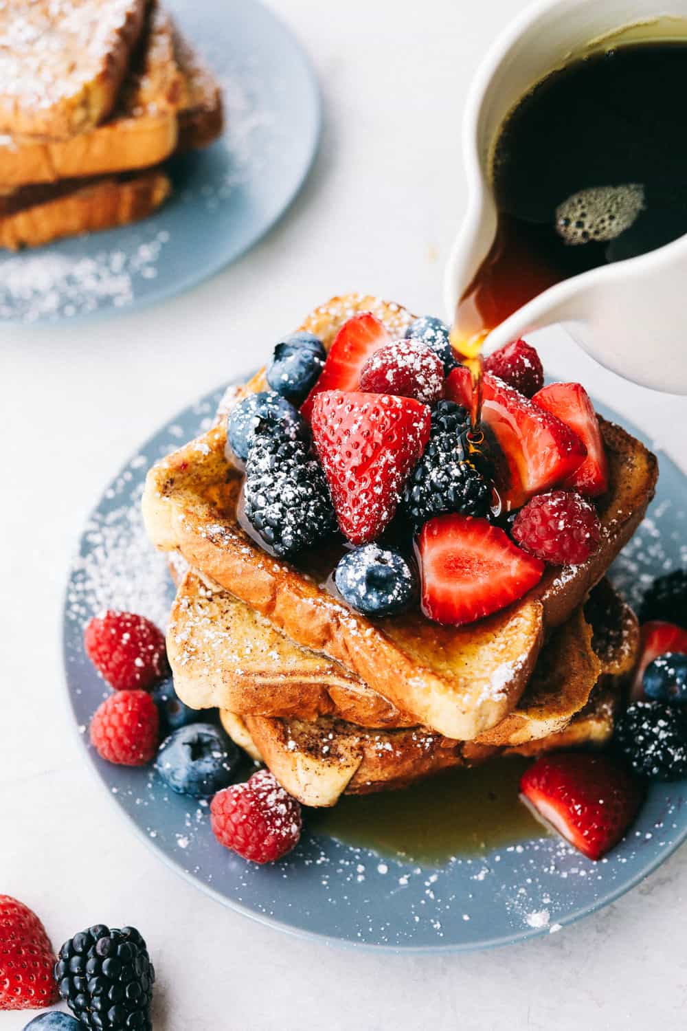 french toast with powdered sugar and syrup