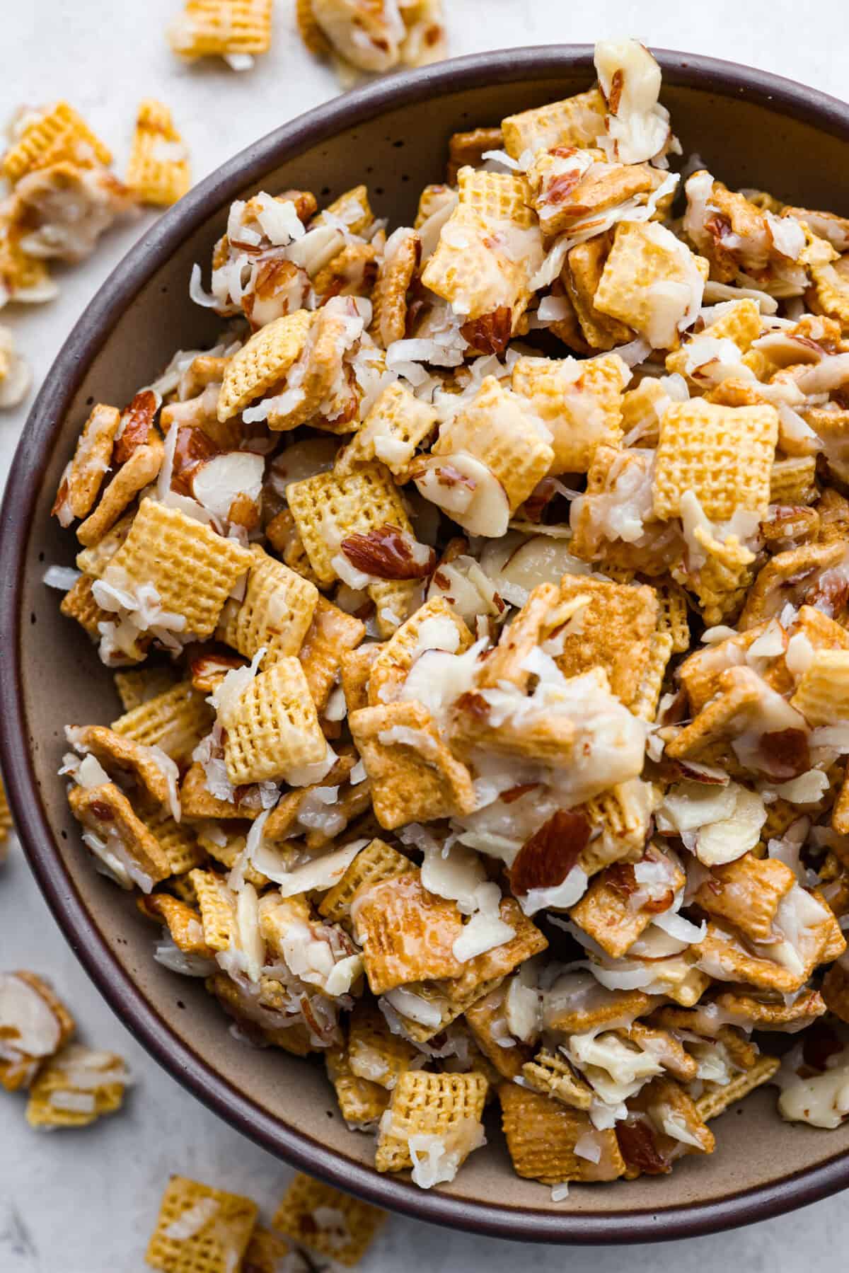 Overhead shot of a bowl of Ooey gooey Chex mix. 