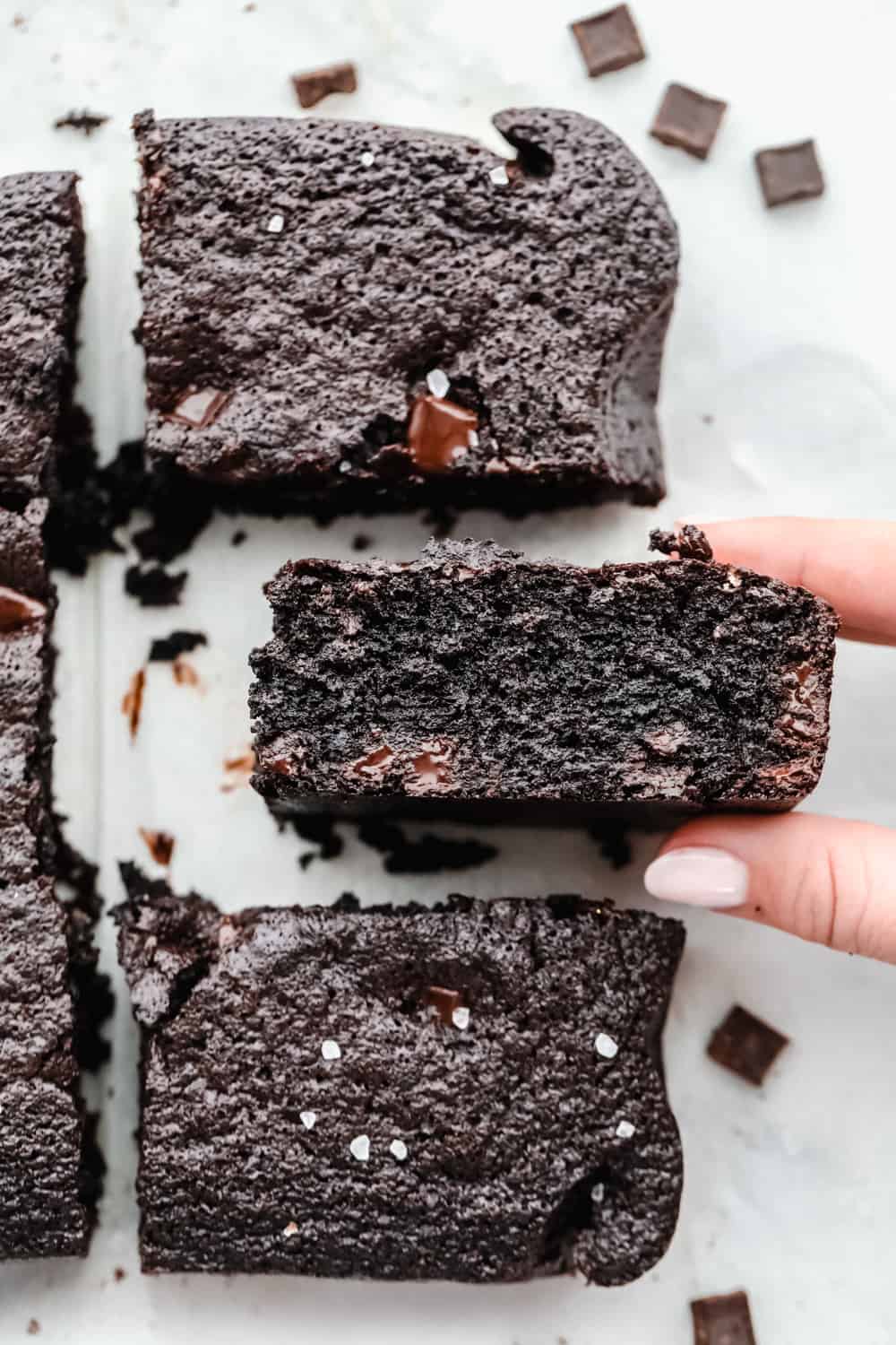 Keto brownies cut and shown how thick they are. 