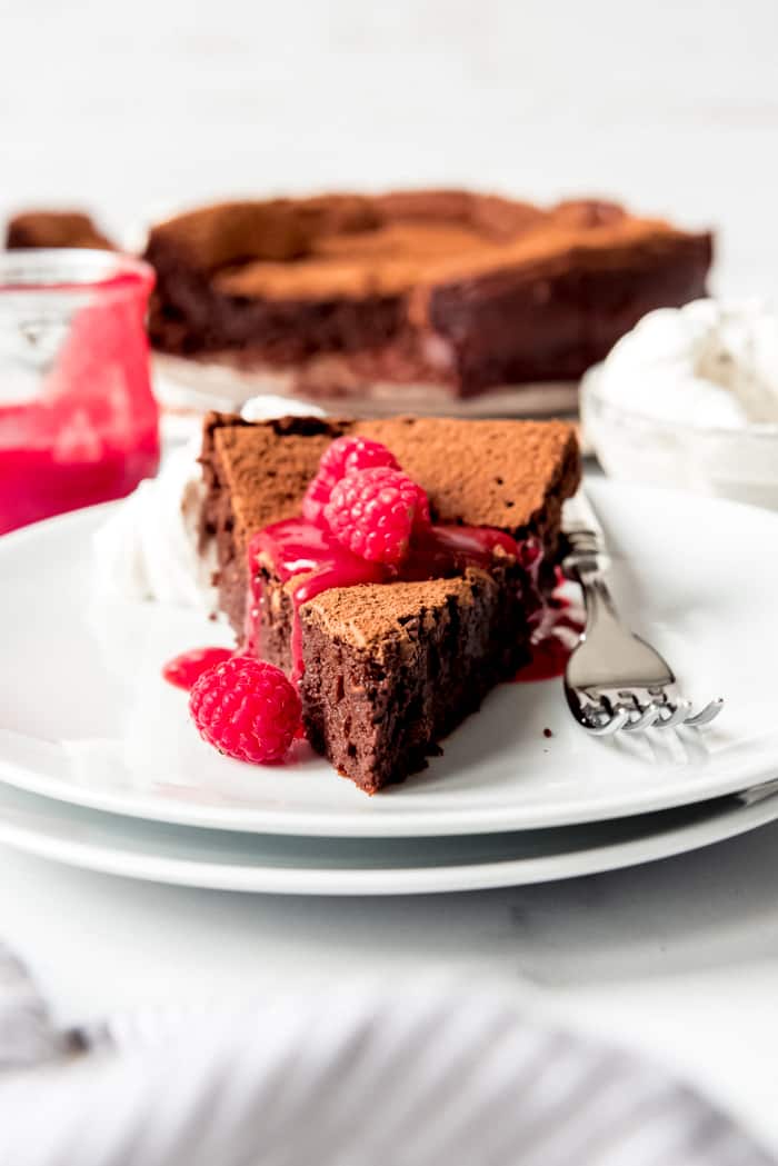 An image of a slice of flourless chocolate torte.