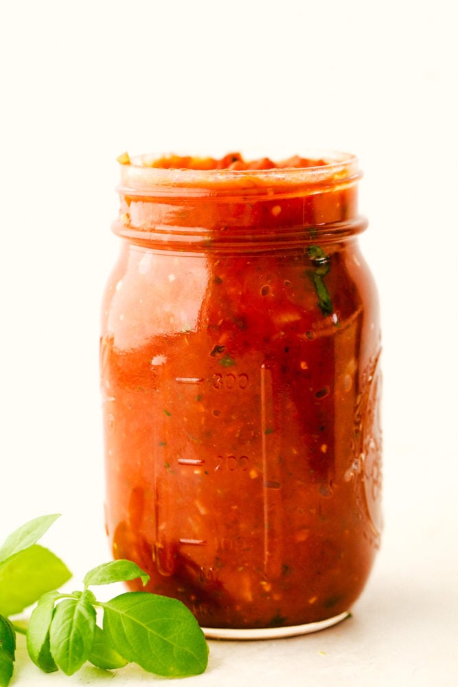 Homemade marinara sauce in a mason jar.