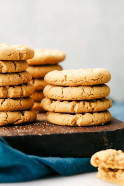 Easy 3 Ingredient Peanut Butter Cookies are soft, fluffy and full of creamy peanut butter with sweet sugar and a large egg, it is that simple. Only 3 Ingredients to make these deliciously desirable cookies! 3 Ingredient peanut butter cookies stacked on top of each other.