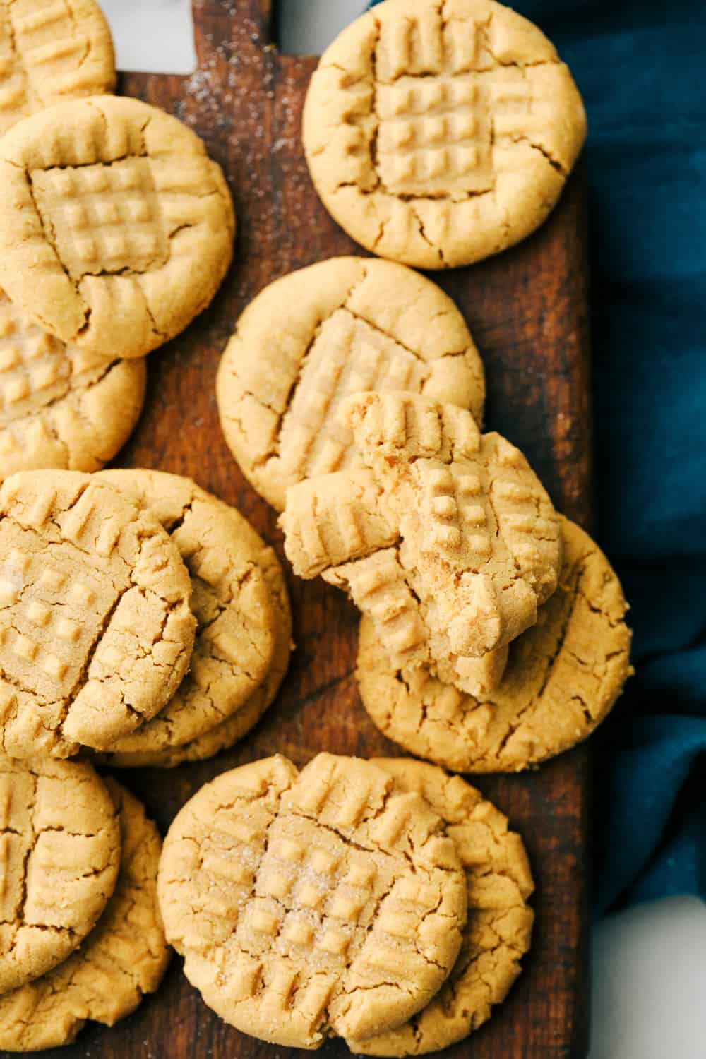 3 Ingredient peanut butter cookies baked an on a cutting board. 