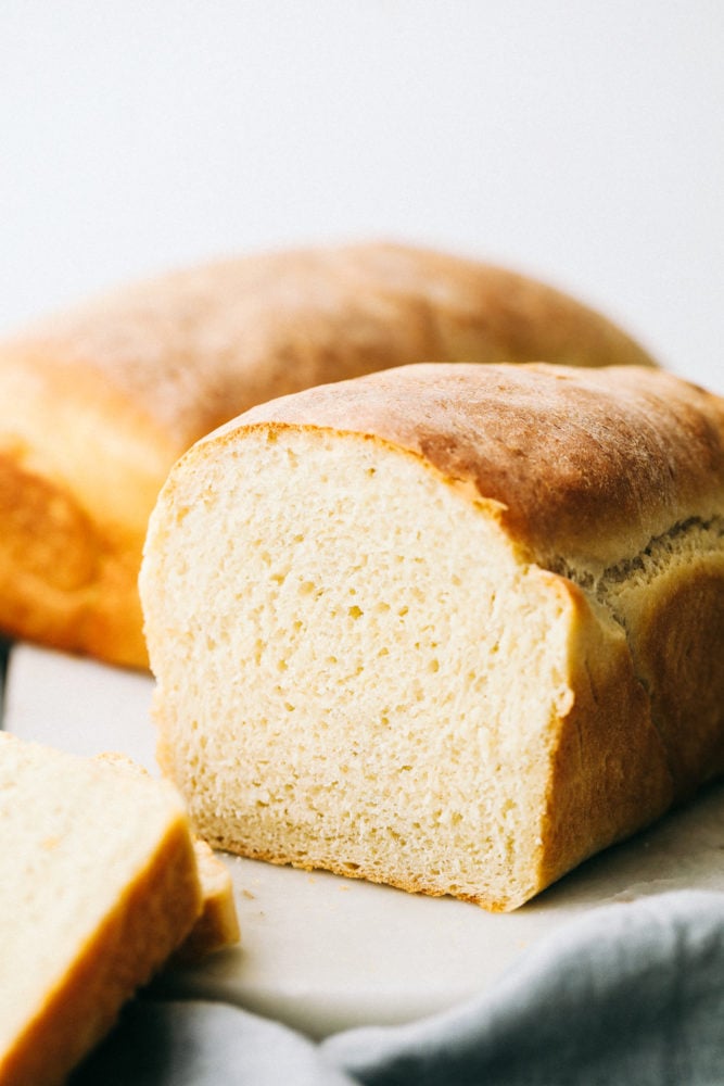 Homemade bread standing tall and cut in half. 