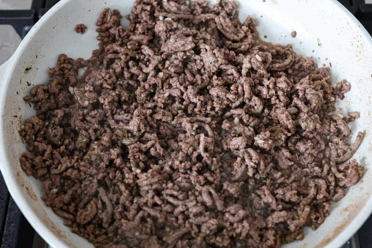 Overhead shot of browned beef in a skillet. 