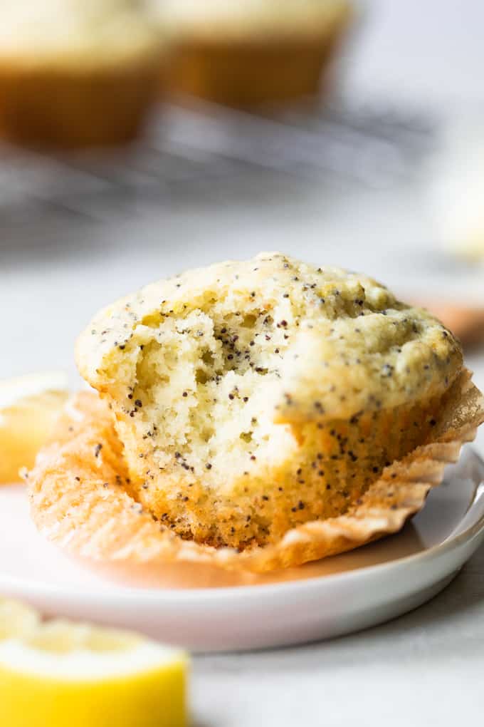 Lemon poppyseed muffin with a bite out of it. 