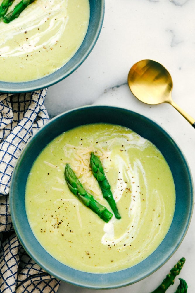 Asparagus soup garnished with asparagus tips. 