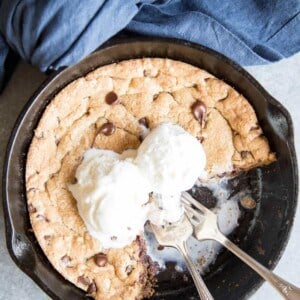 Pizookie with ice cream in a cast iron skillet