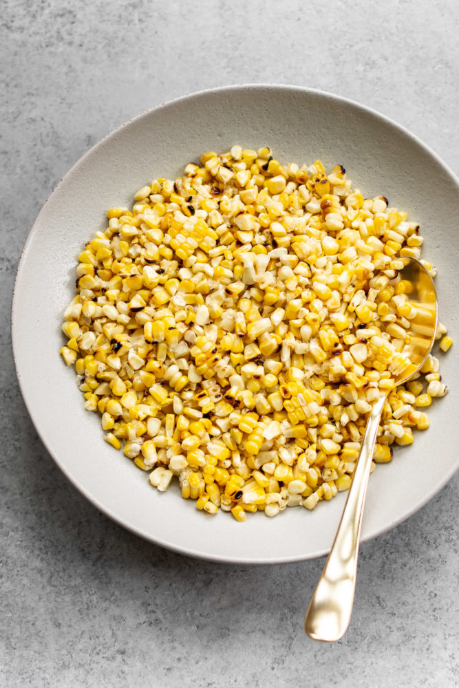 Grilled corn in a serving bowl.