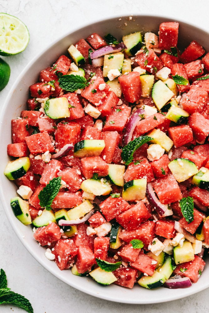 Watermelon salad in a white bowl. 