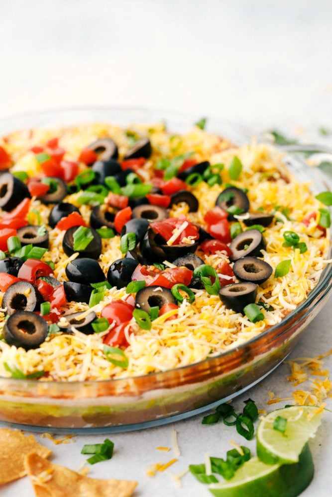 7 layer dip in a clear dish.