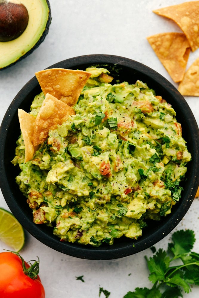 Guacamole in a black bowl.