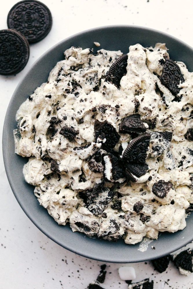 Oreo fluff on a black plate.