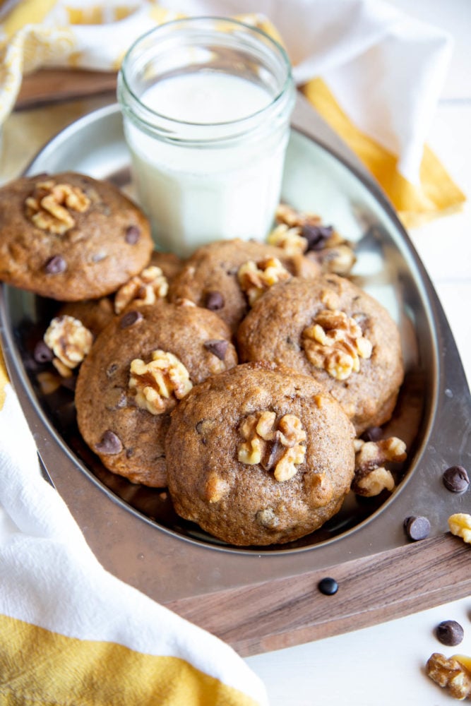 Banana cookies on a serving tray with milk