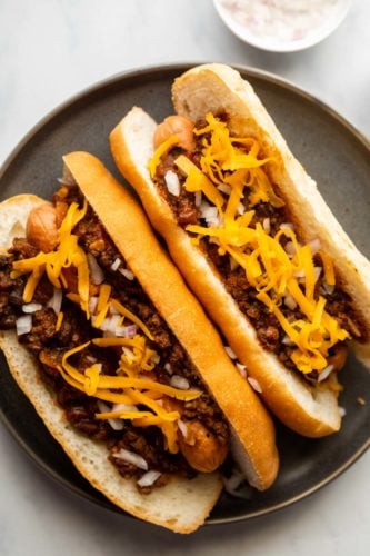 Closeup of chili dogs on a plate