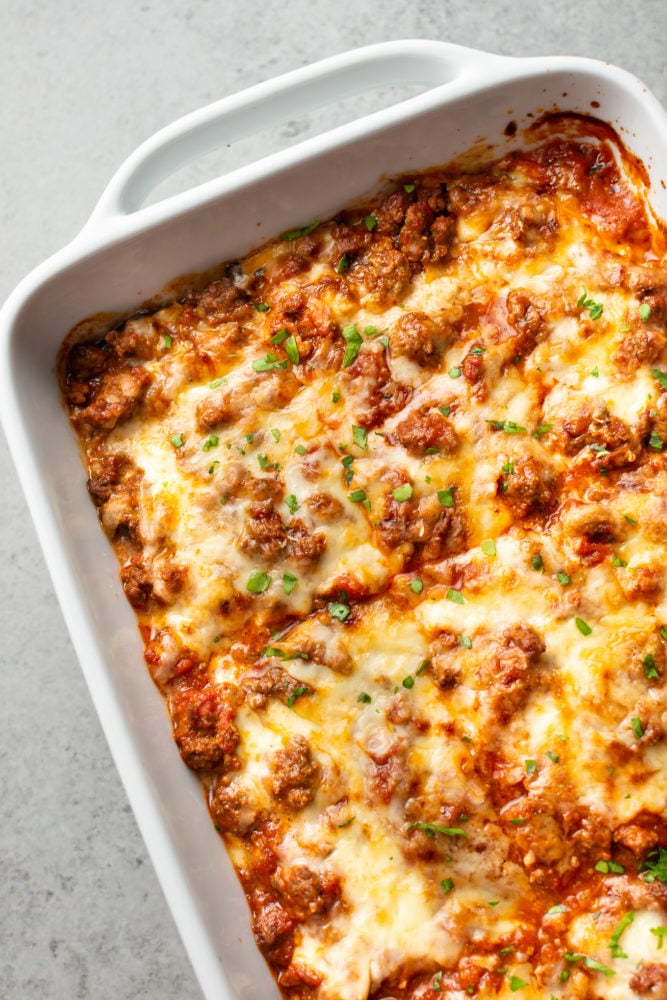 close-up of eggplant lasagna in a white baking dish