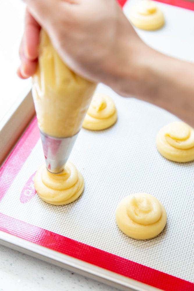 Piping choux pastry for baking