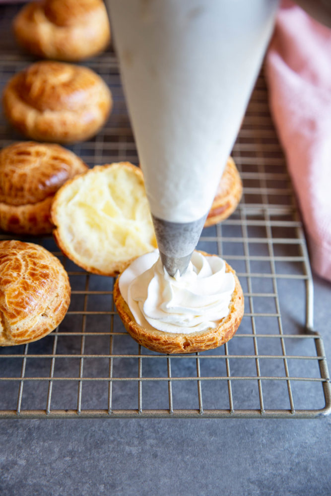 Adding whipped cream filling to cream puffs