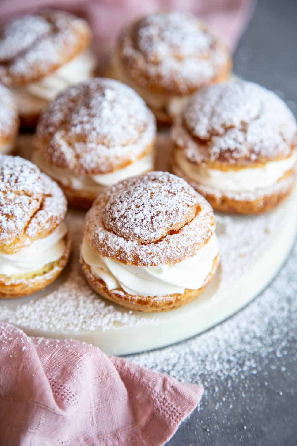 Cream puffs on a serving plate