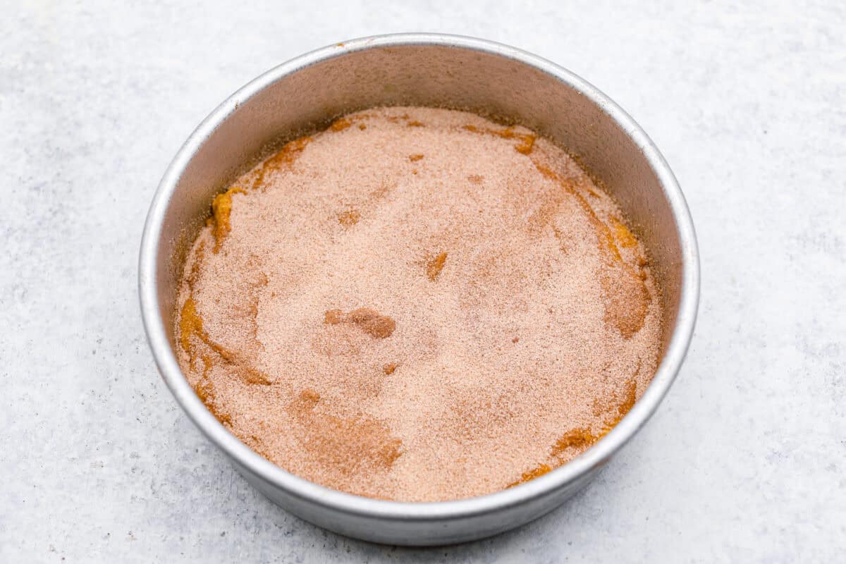 Overhead shot of the bottom layer of the cake with cinnamon sugar swirl on top. 