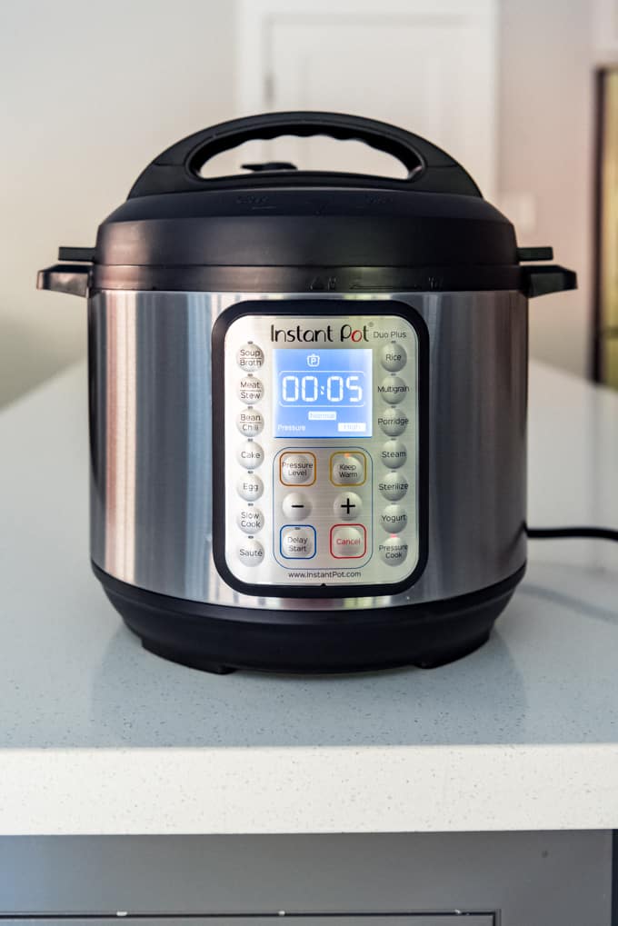 An Instant Pot set to cook on high pressure for 5 minutes.
