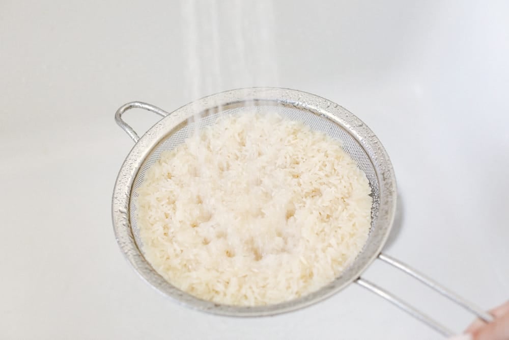 Rinsing Rice before cooking.