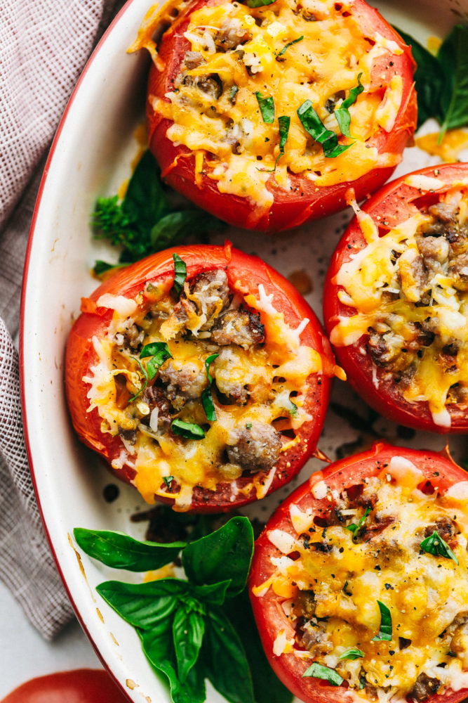 Cheesy Stuffed Tomatoes with Sausage are tomatoes stuffed with a hearty sausage and rice filling and topped with gooey cheese.
