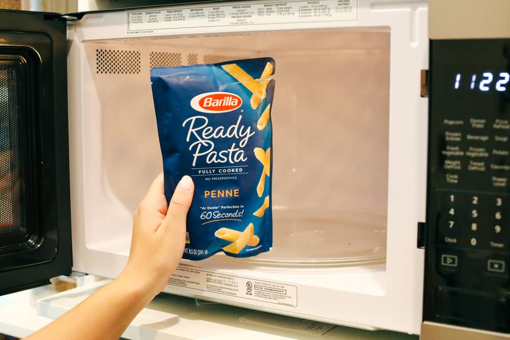 Barilla Ready Pasta being put in the microwave. 
