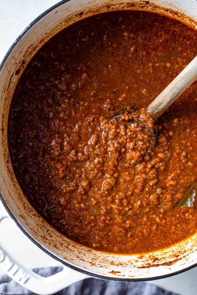 Chili in a pot with a wooden spoon in it. 